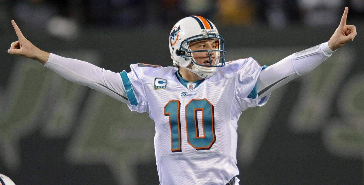 Miami Dolphins quarterback Chad Pennington signals a play during the fourth quarter of an NFL football game against the New York Jets at Giants Stadium in East Rutherford, N.J in this photo from Dec. 28, 2008.
