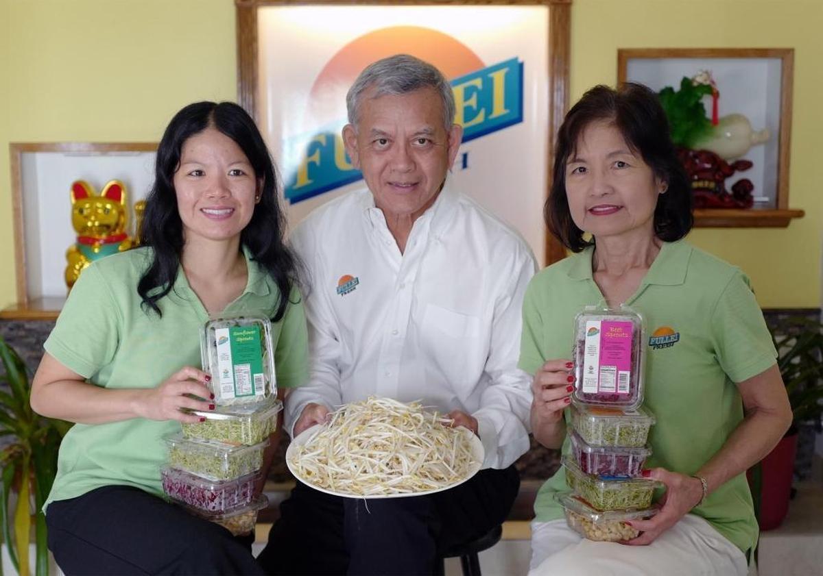 Manny Wong, president, CEO and owner of Fullei Fresh, is flanked by his daughter Olivia Wong, left, and Silvia Wong, his wife. They’re showing some of the company’s products at the main office at their Miami plant.