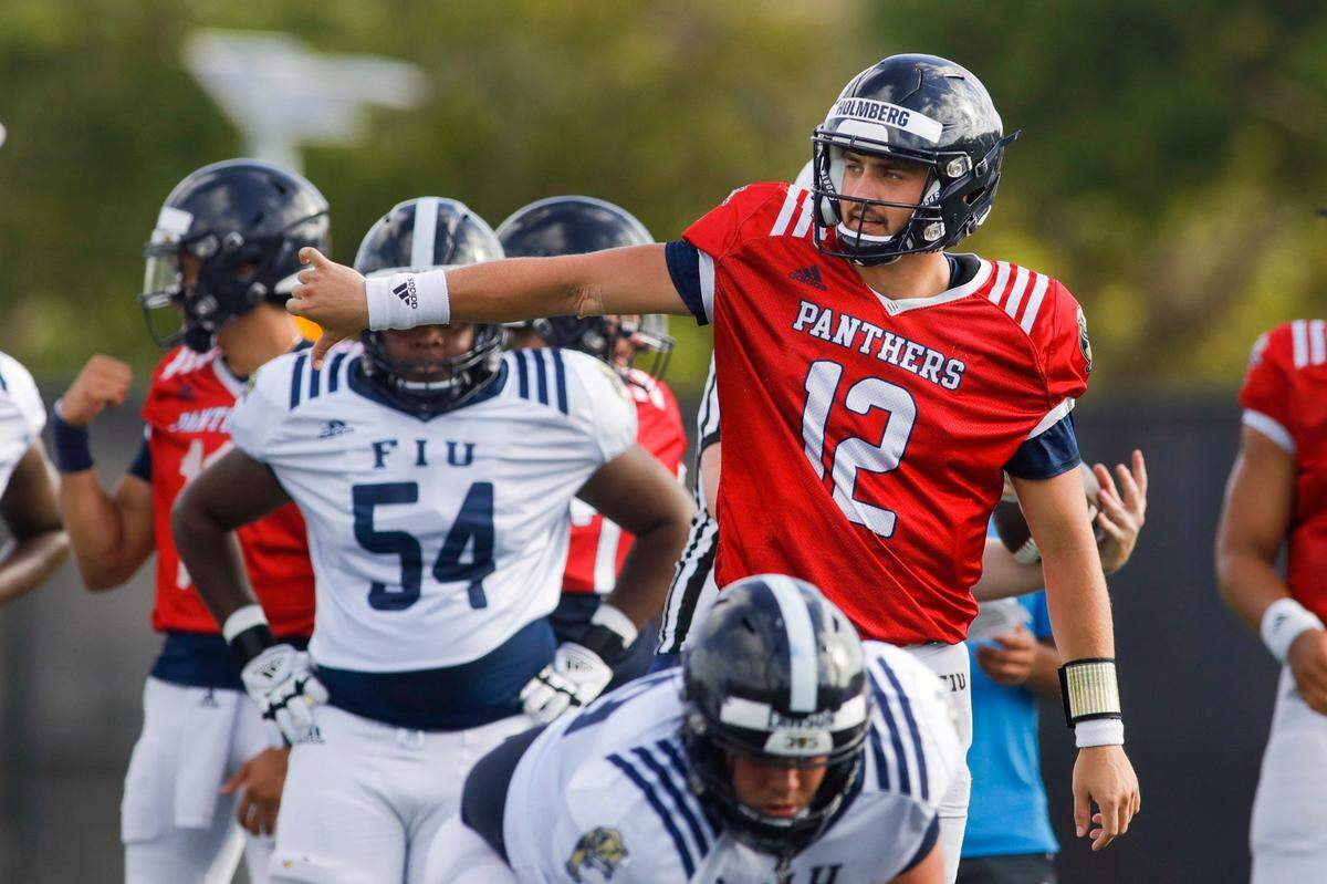 Florida International University quarterback Gunnar Holmberg (12) signals from the field during football practice at the practice fields at Florida International University in Miami, Florida, on Thursday, March 24, 2022.
