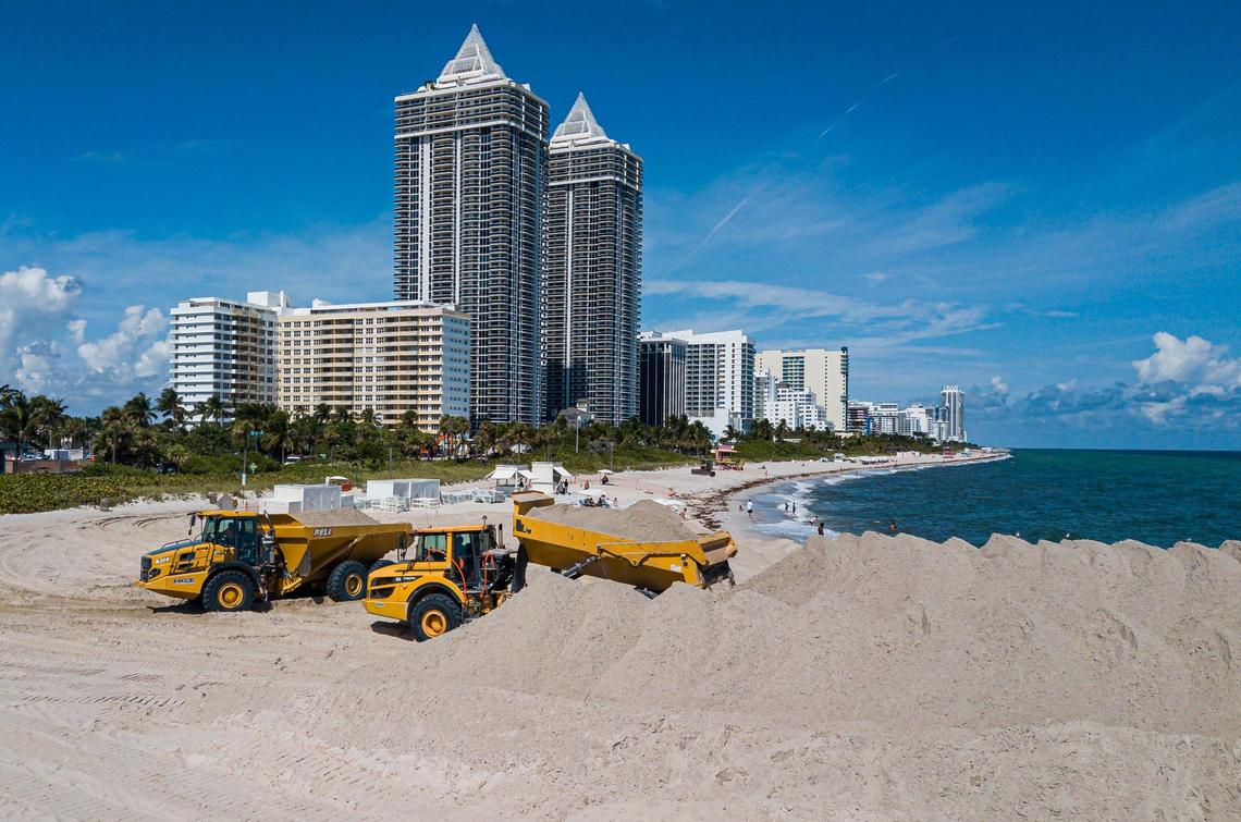 Trucks offload sand near Indian Beach Park in Miami Beach, as part of a U.S. Army Corps of Engineers beach renourishment project on Oct. 12, 2022.