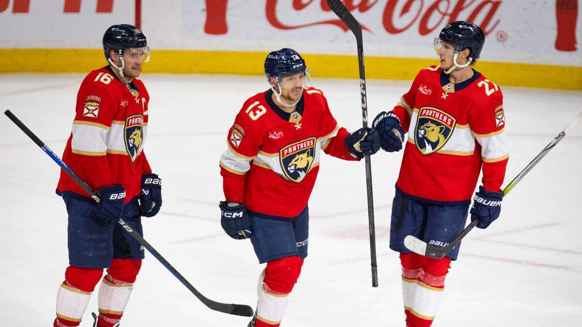 Florida Panthers center Sam Reinhart (13) celebrates his open net goal with centers Aleksander Barkov (16) and Eetu Luostarinen (27) during the third period of a hockey game on Tuesday, April 16, 2024, at Amerant Bank Arena in Sunrise, Fla. The Florida Panthers won 5-2.