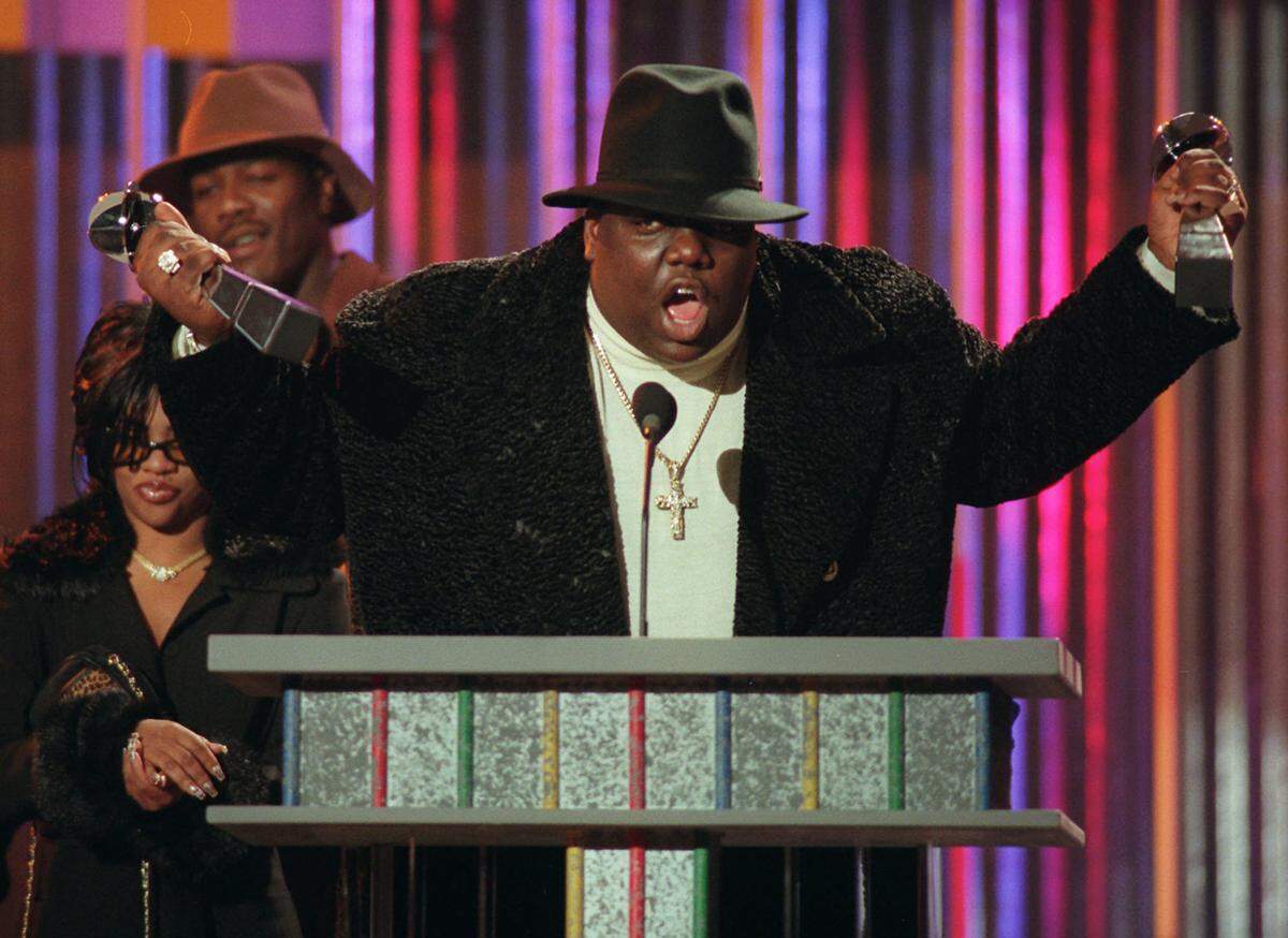 FILE - In this Dec. 6, 1995 file photo, rapper Notorious B.I.G., who won rap artist and rap single of the year, clutches his awards at the podium during the annual Billboard Music Awards in New York. Records show FBI agents on both coasts participated in an 18-month investigation aimed at finding out who killed the Notorious B.I.G. and determine whether any Los Angeles police officers were involved. The inquiry ended in early 2005 after federal prosecutors concluded there wasn’t enough evidence to pursue a case against any Los Angeles Police Department officers or another man implicated in the rapper’s 1997 shooting death. (AP Photo/Mark Lennihan, File)