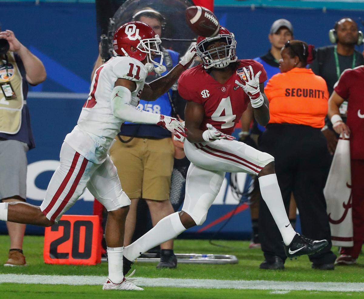 Alabama wide receiver Jerry Jeudy (4) eyes a pass as Oklahoma cornerback Parnell Motley (11) attempts to defend, during the second half of the Orange Bowl NCAA college football game, Saturday, Dec. 29, 2018, in Miami Gardens, Fla. (AP Photo/Wilfredo Lee)