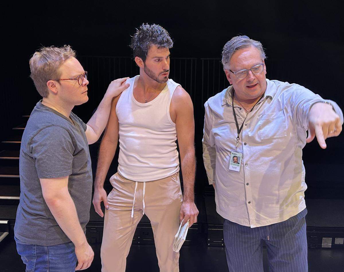 Alex Weisman as Eric Glass and Anthony Michael Martinez as Toby Darling take direction from Stuart Meltzer during rehearsals of “The Inheritance, Part 1.”