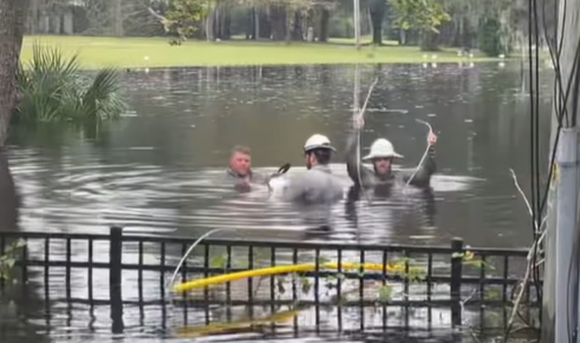 Video viewed more than 300,000 times on Facebook shows one lineman was diving underwater while trying to restore power in the Brooksville area of Florida.
