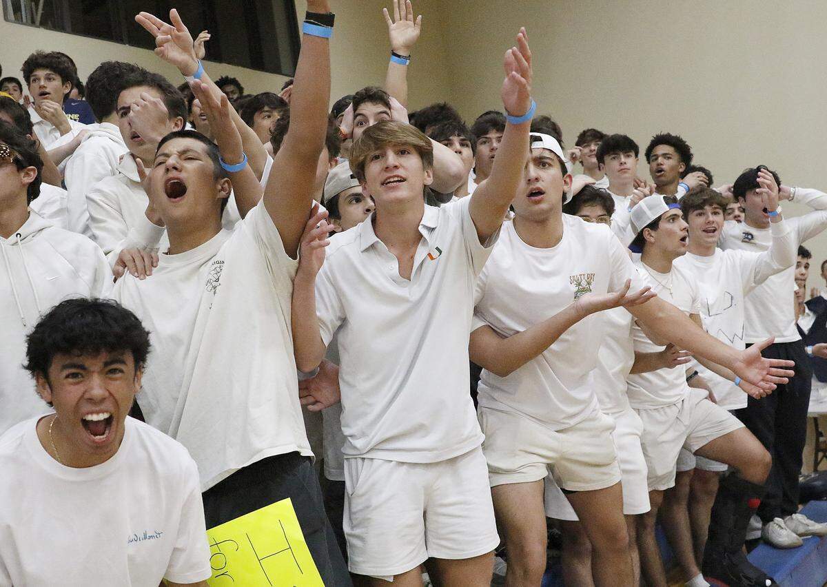 Belen Jesuit Wolverines fans cheer for their team during the Region 4-5A semifinal boys basketball game gainst Plantation Colonels on Saturday, February 21, 2026 at Belen Jesuit in Miami. Andrew Uloza / for Miami Herald