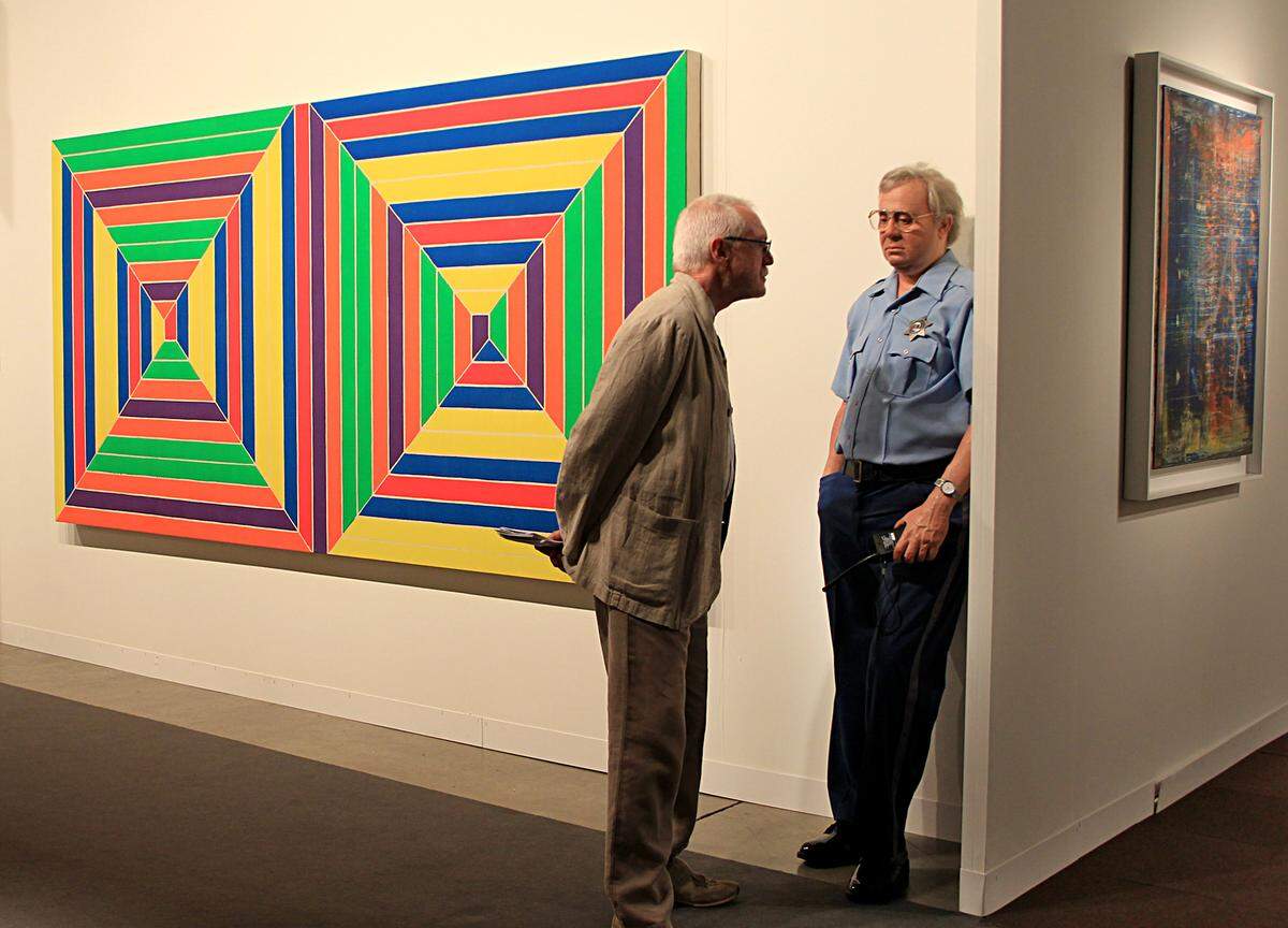 A visitor looks at a piece by artist Duane Hanson at Art Basel in Miami Beach in 2011.