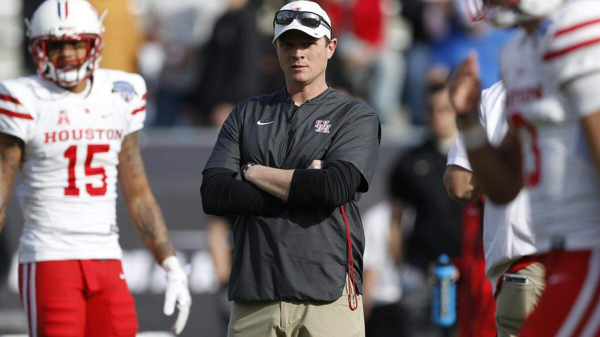 Houston head coach Major Applewhite watches as his team warms up before they play Army in the of Armed Forces Bowl NCAA college football game Saturday, Dec. 22, 2018, in Fort Worth, Texas.