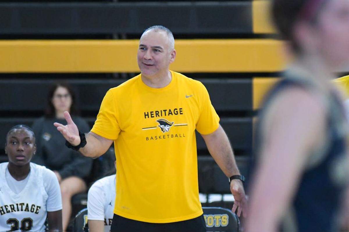 Plantation American Heritage girls’ basketball coach Greg Farias calls out to his team during the first quarter of a regular-season game against North Broward Prep on Saturday, Jan. 7, 2023.