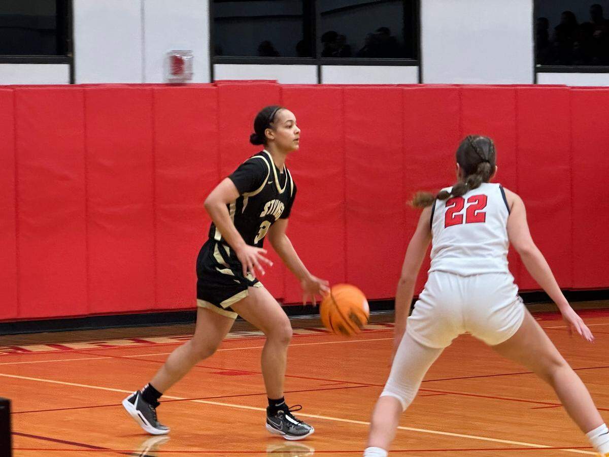 Miami High’s Sydney Wilson (left) looks to drive the ball down court with Doral’s Ashley Martinez defending during Friday’s Region 4-7A final at Doral Academy.