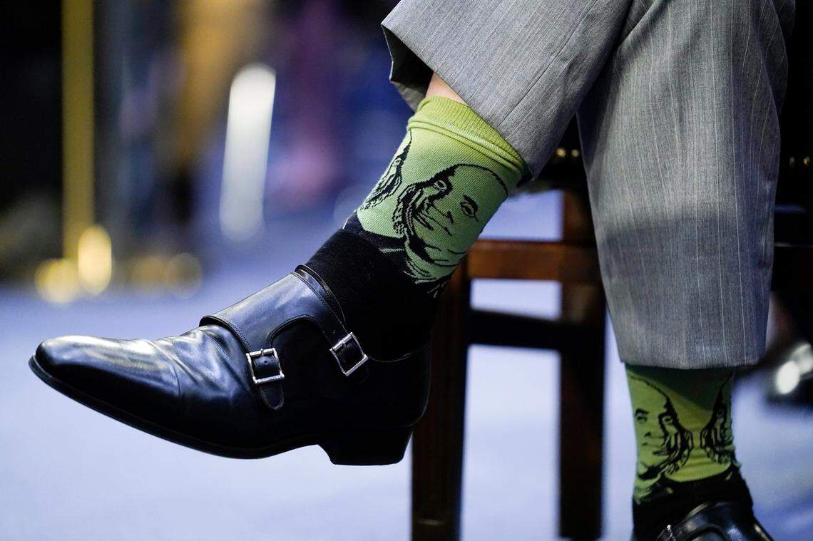 Supreme Court nominee Ketanji Brown Jackson’s husband, Dr. Patrick Jackson, wears socks with the likeness of Benjamin Franklin on them during her Senate Judiciary Committee confirmation hearing on Capitol Hill in Washington, Tuesday, March 22, 2022.
