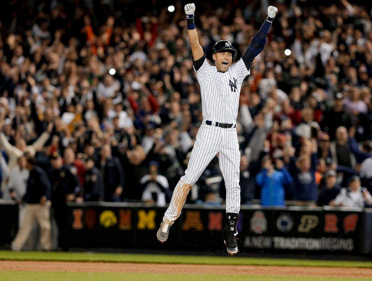 In this Sept. 25, 2014, file photo, New York Yankees’ Derek Jeter jumps after hitting the game-winning single against the Baltimore Orioles in the ninth inning of a baseball game, in New York. The Yankees won 6-5. It was Jeter’s last home game of his career at Yankee Stadium. The Baseball Hall of Fame will induct Jeter on Wednesday, Sept. 8, 2021.