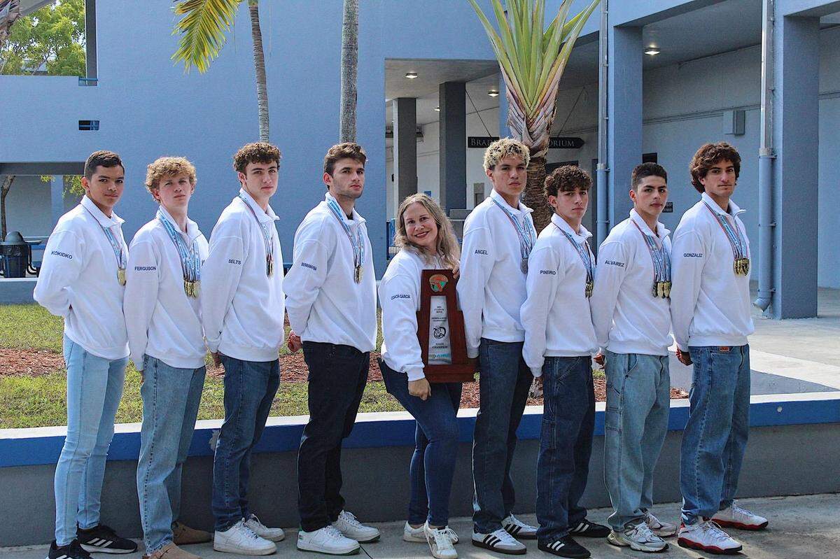 Braddock swimming coach Katia Garcia (middle) is the Miami Herald’s Boys’ Swimming and Diving Coach of the Year.