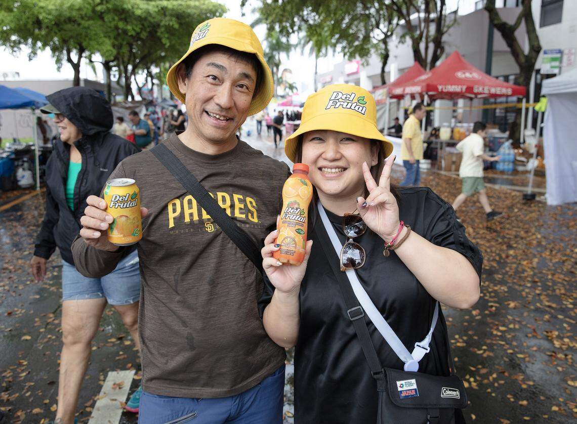 Airi Sakuraba and Keiichi Nakajima, a couple from Tokyo (japan) attends Calle Ocho festival while visiting U.S. on Sunday, March 15, 2026 in Little Havana. Andrew Uloza / for Miami Herald