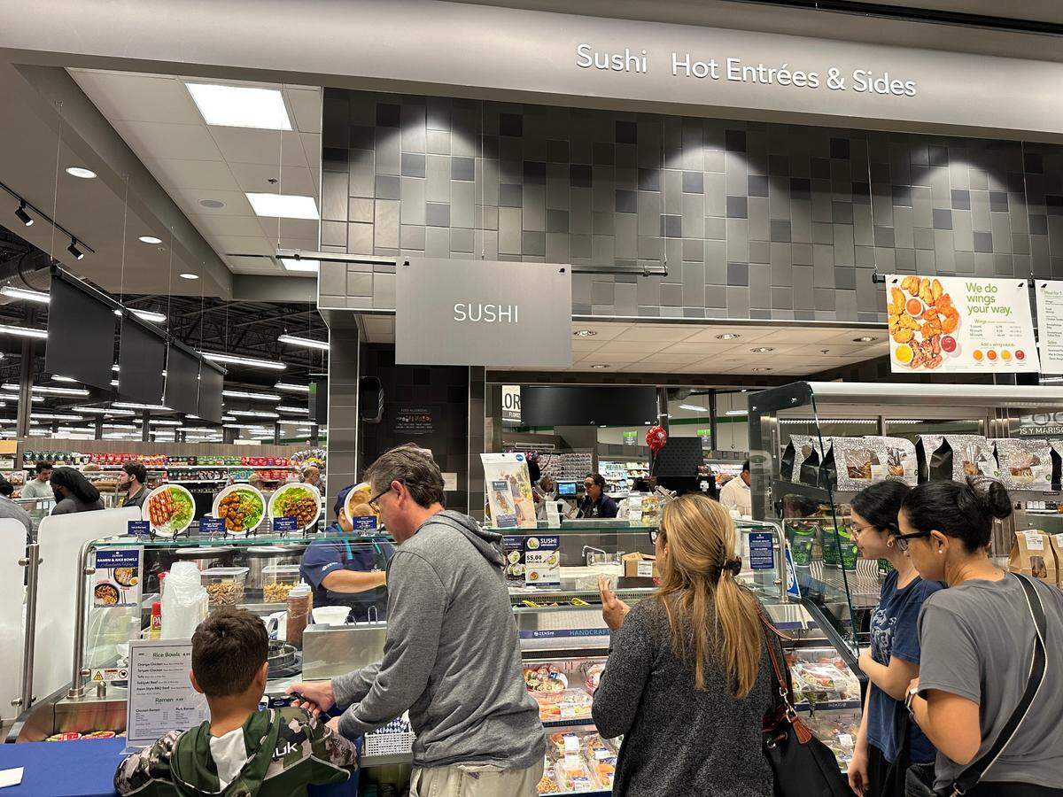 Step across from the Pub Sub counter at the deli and you’ll find a sushi department at the new Briar Bay Publix. Customers place orders on March 2, 2025.