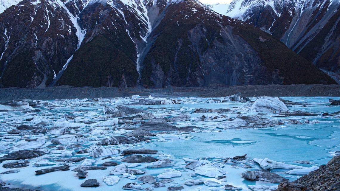 A man was rescued after escaping a damaged inflatable boat and becoming stranded on an iceberg, police said. The photo shows Tasman Lake, Mount Cook.