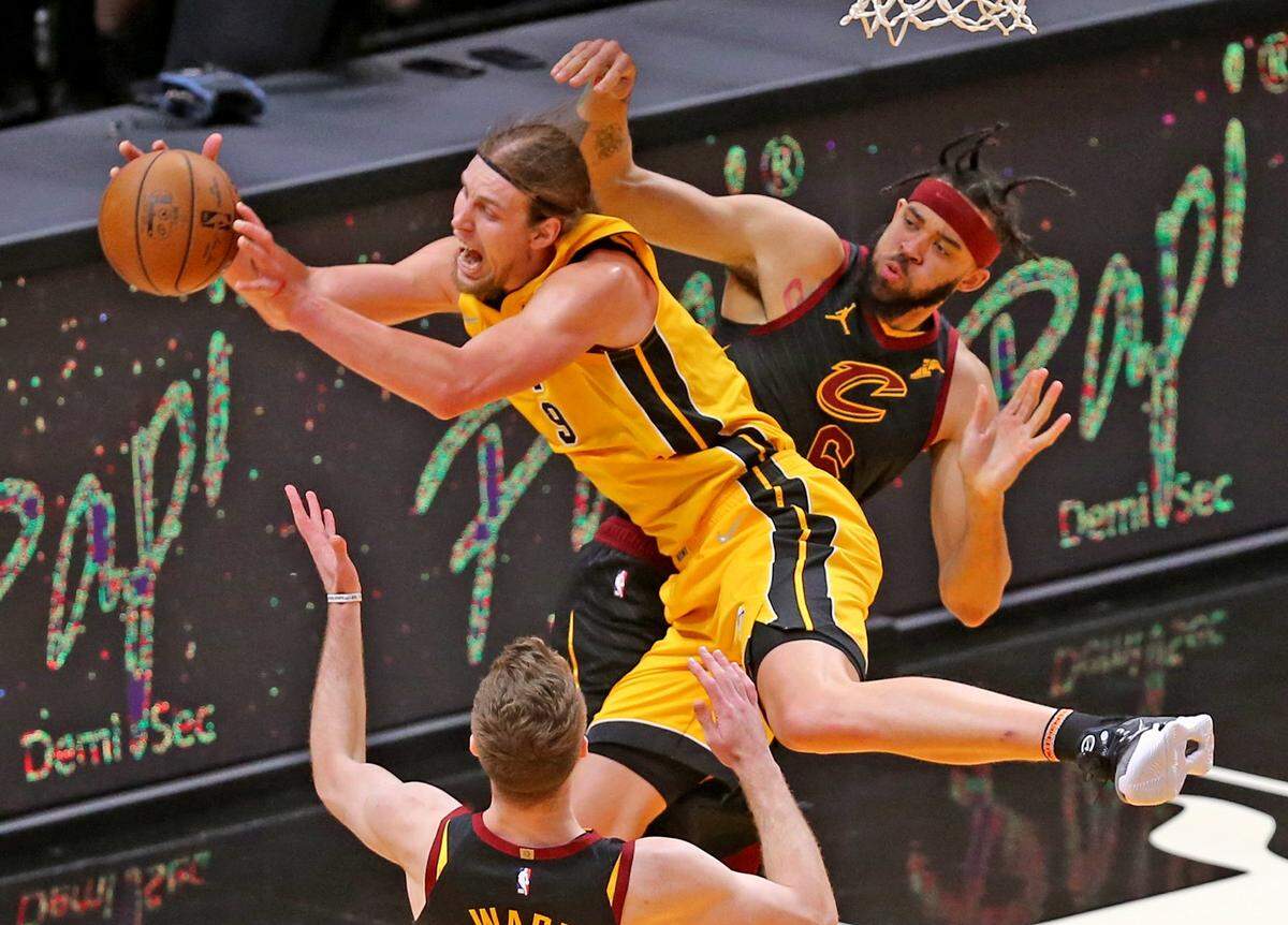 Miami Heat Kelly Olynyk (9) is fouled by Cleveland Cavaliers JaVale McGee (6) in the second quarter at AmericanAirlines Arena in Miami, Florida, Tuesday, March 16, 2021.