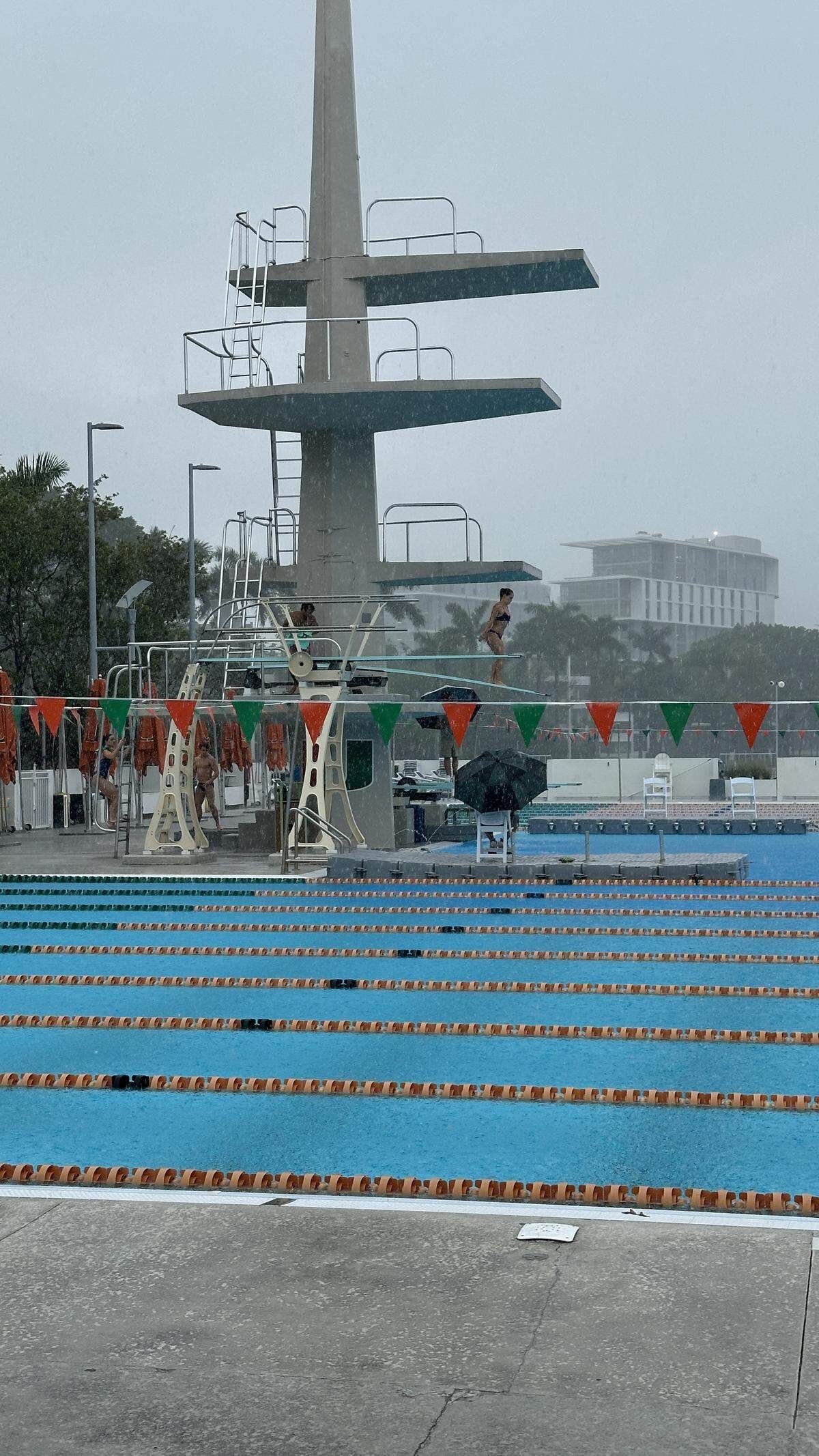 Coaches hunkered under umbrellas on the deck but Hurricanes divers and swimmers weren’t letting Friday’s downpours dissuade them from making practice on March 13, 2026.