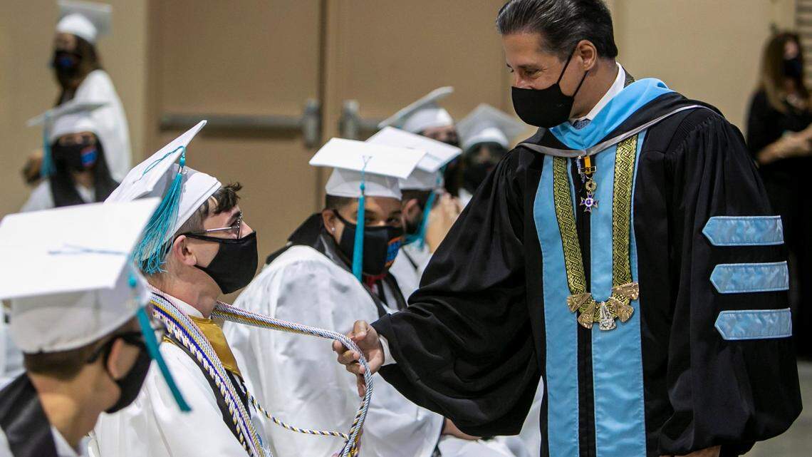 Miami-Dade County Schools Superintendent Alberto Carvalho speaks with a student during a June 1 graduation ceremony amid the pandemic. The district’s 2020-21 graduation rate increased 0.5% to 90.1%, the Florida Department of Education said Tuesday.