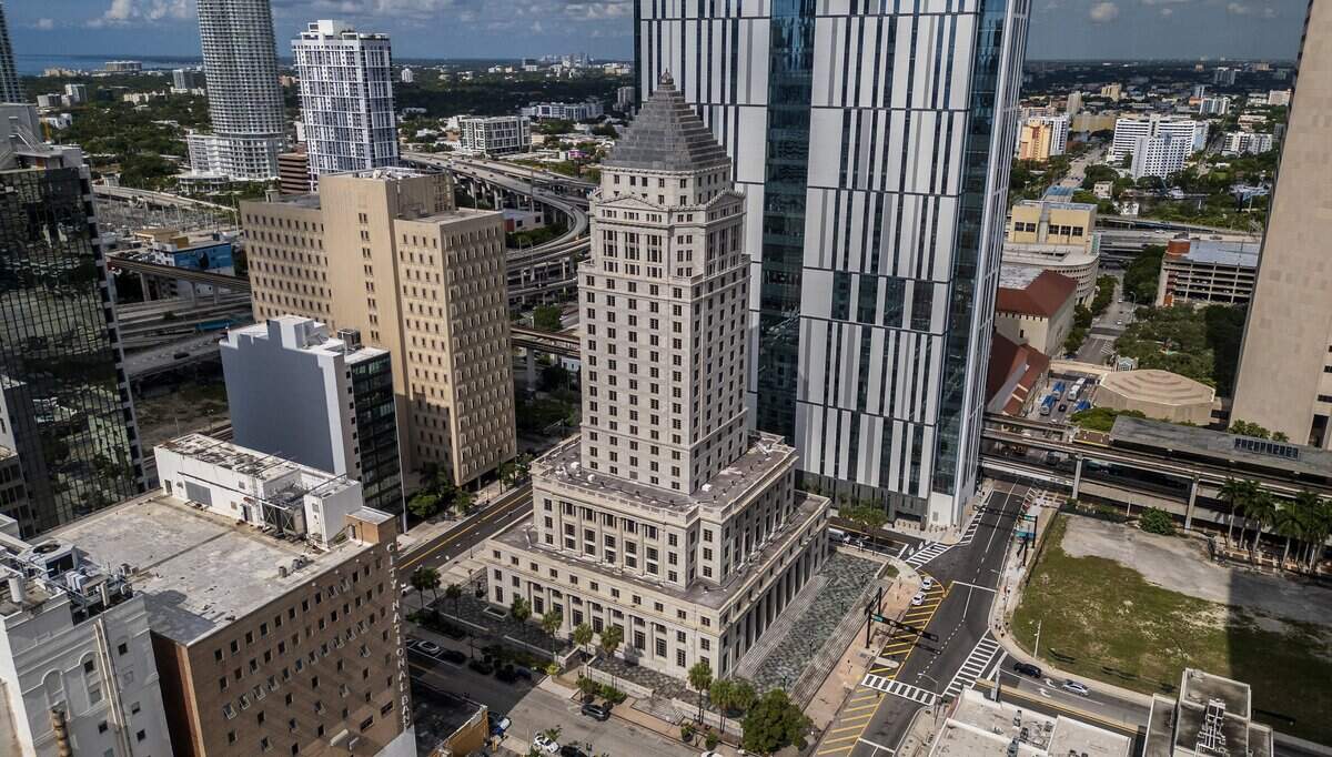 View of the historic and abandoned Miami-Dade County Courthouse which opened in 1928, that has been up for sale for years, but the county can't find a buyer at the right price. Its replacement, the new Osvaldo N. Soto Miami-Dade Justice Center, is seen in the back, in downtown Miami, Florida on Tuesday, June 30, 2026.