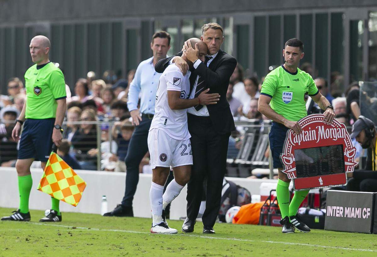 Inter Miami forward Federico Higuain (22) hugs Inter Miami head coach Phil Neville during the second half of their MLS soccer match against New York City FC at DRV PNK Stadium on Saturday, October 30, 2021, in Fort Lauderdale, Florida. This match was Federico’s last home game before retiring from Major League Soccer at the conclusion of this season.