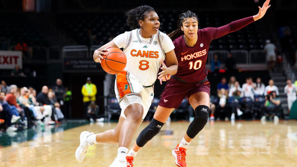 Miami Hurricanes Darrione Rogers(8) drives passed Virginia Tech’s Carys Baker (10) during the first quarter a game on Sunday, Jan. 5, 2025, at Watsco Center in Coral Gables, Fla.