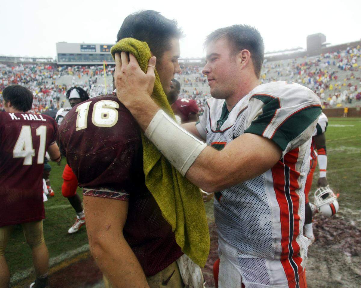 In 2003, UM QB Brock Berlin comforts FSU QB Chris Rix after the game, a 22-14 Hurricanes victory.
