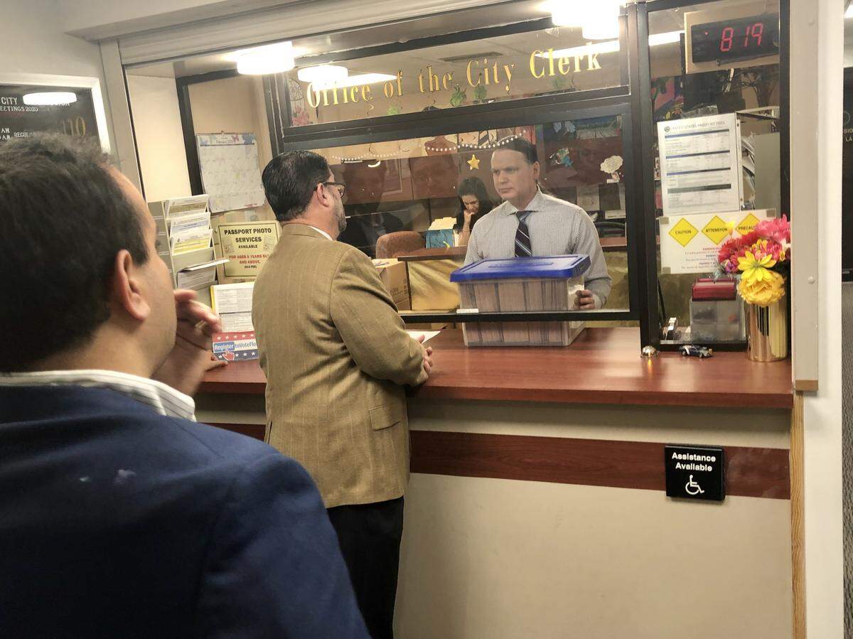 Organizers of the effort to recall Miami Commissioner Joe Carollo submitted a box full of petitions Monday morning at City Hall.