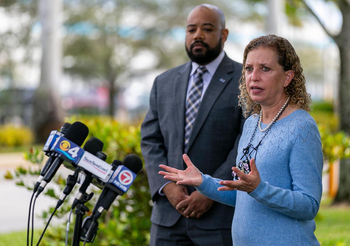 Rep. Debbie Wasserman Schultz (D-Fla.) and Broward County Supervisor of Elections Joe Scott hold a press conference outside of the U.S. Postal Service Mail Processing Facility in Opa-locka, Florida on Monday, January 10, 2022. Wasserman Schultz and Scott said they toured the processing facility to inspect what mail delivery problems may have occurred in the primary, and to help ensure those same issues are not repeated.