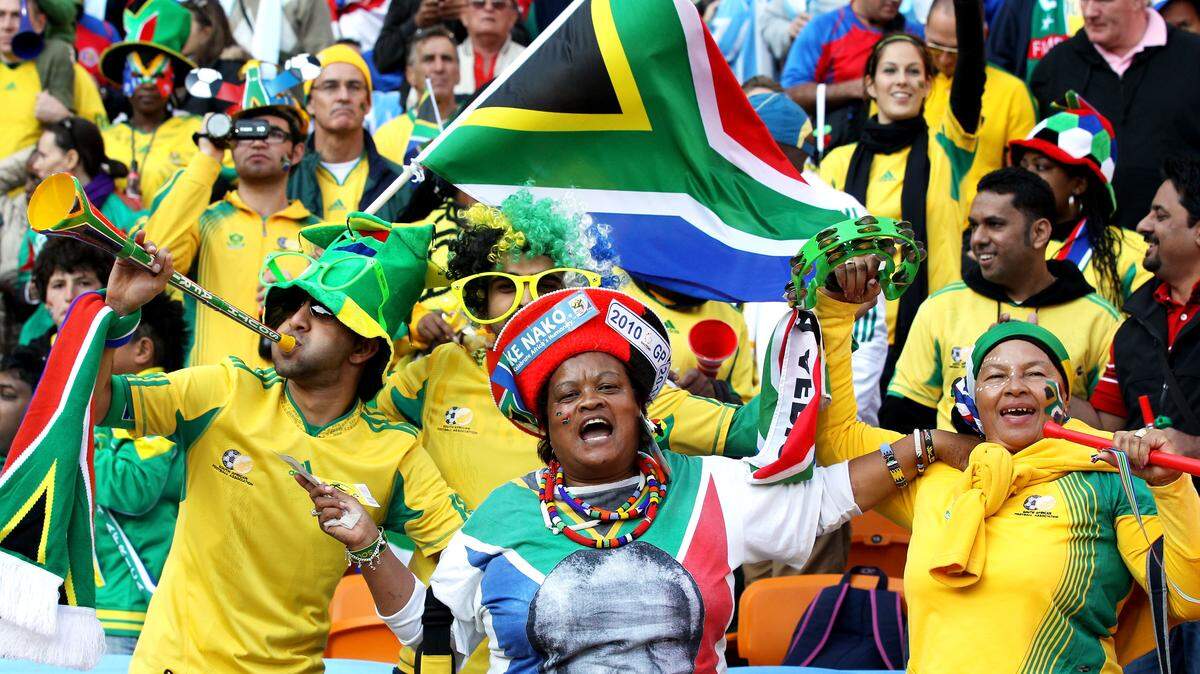 JOHANNESBURG, SOUTH AFRICA - JUNE 11:  South Africa fans show their support for Nelson Mandela at the Opening Ceremony ahead of the 2010 FIFA World Cup South Africa Group A match between South Africa and Mexico at Soccer City Stadium on June 11, 2010 in Johannesburg, South Africa.  (Photo by Phil Cole/Getty Images)