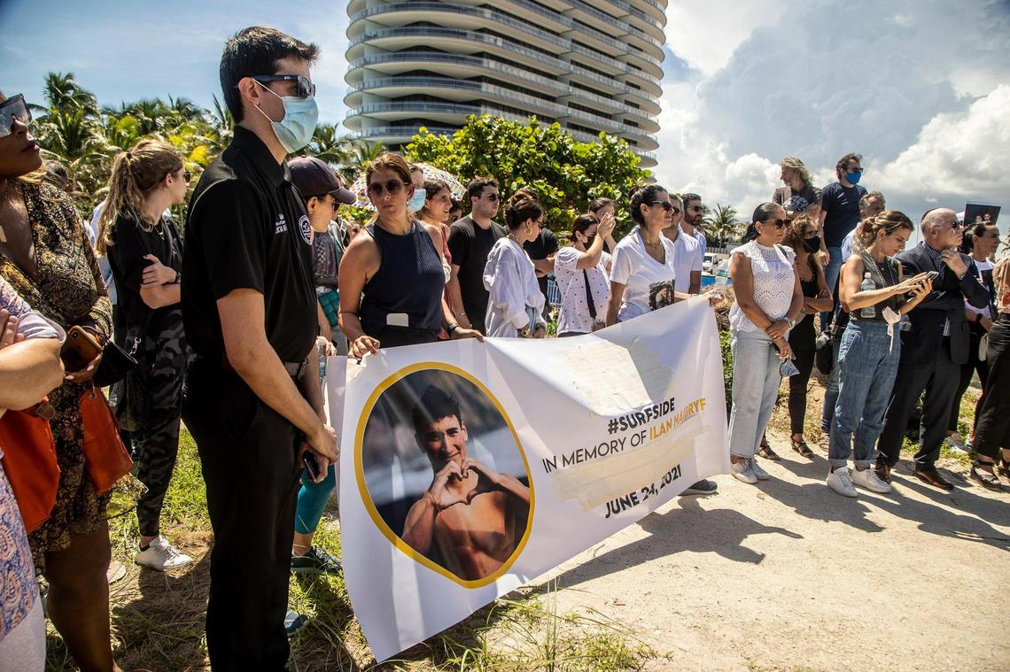 Families of Surfside collapse victims gather together as they held a press conference Thursday, Sept. 23, 2021, at the site of the Champlain Towers South condo collapse to call for a memorial to be constructed where 98 victims died in Surfside, Florida.