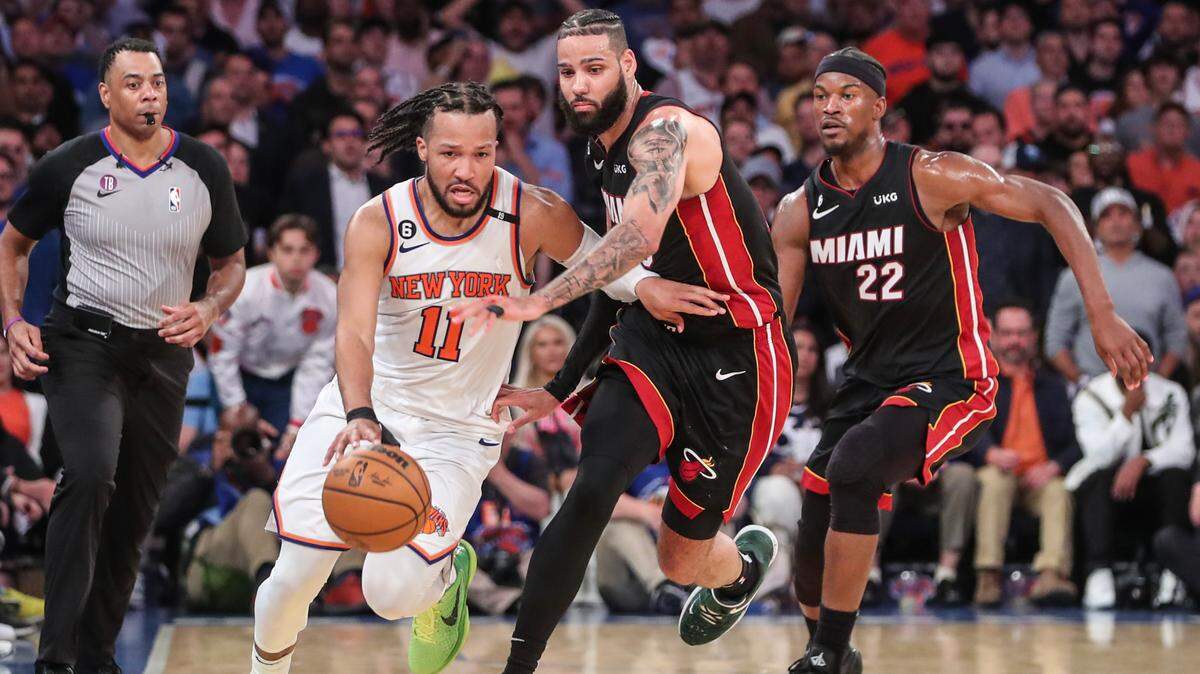 New York Knicks guard Jalen Brunson (11) drives past Miami Heat forward Caleb Martin (16) during game five of the 2023 NBA playoffs at Madison Square Garden.