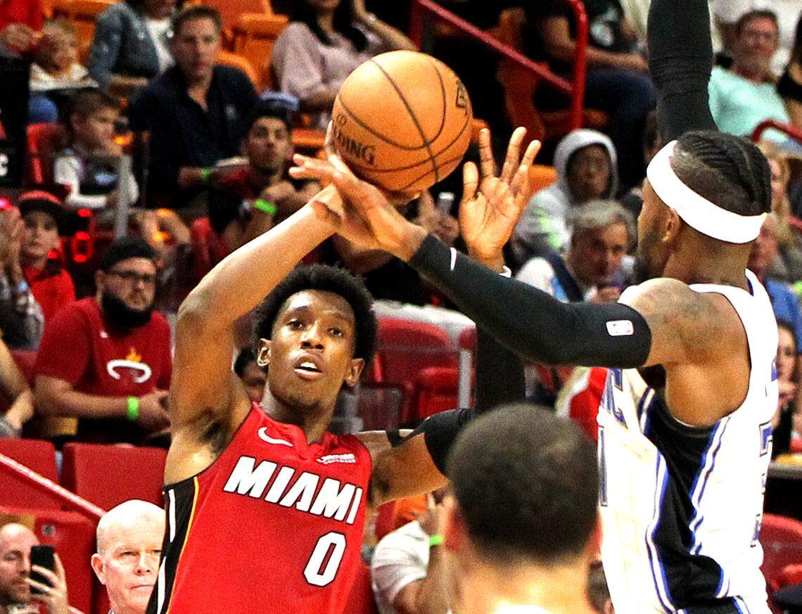 Heat guard Josh Richardson shoots to the basket against Magic’s guard Terrence Ross in the third quarter of the Miami Heat vs Orlando Magic at AmericanAirlines Arena in Miami on Tuesday, December 04, 2018.