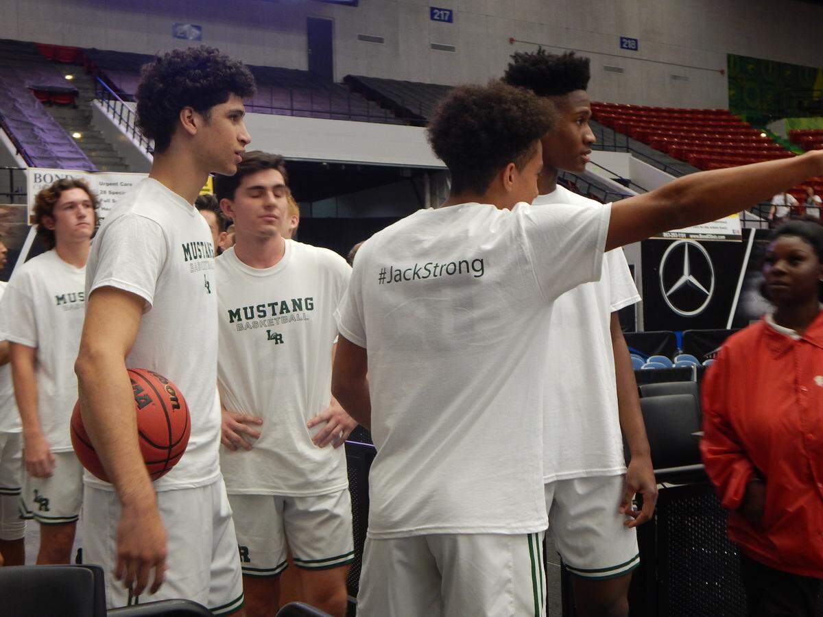The Lakewood Ranch High boys basketball team wears warmup shirts dedicated to Jack Kelley, a member of the 2017 state Final Four team who is in intensive care following a horrific car accident, ahead of Friday’s Class 8A state semifinal against Fleming Island at Lakeland’s RP Funding Center.