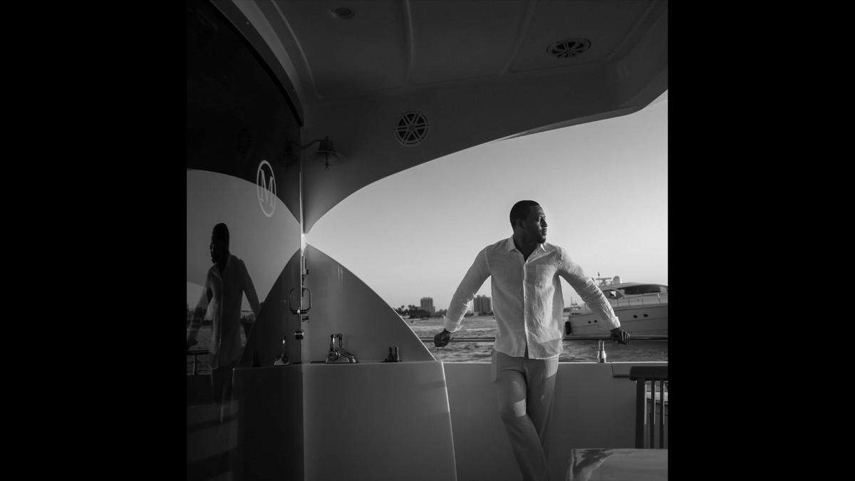 Investment banker David Pulliam, 28, is photographed on the yacht “Big Daddy.” Pulliam finds his connection with water reaffirms his Blackness in the past, present and future.