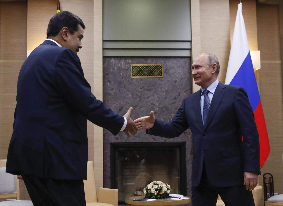Russian President Vladimir Putin, right, greets his Venezuelan counterpart Nicolas Maduro during their meeting at the Novo-Ogaryovo residence in Moscow on Wednesday, Dec. 5, 2018.