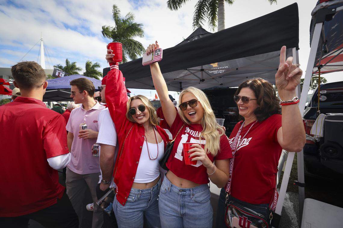 Ashley Wheat, left, Erica Shepherd, center, and Shepherd’s mother, tailgate outside the stadium before the College Football Playoff National Championship Game against the Miami Hurricanes at Hard Rock Stadium on Monday, Jan. 19, 2026 in Miami Gardens, Fla.