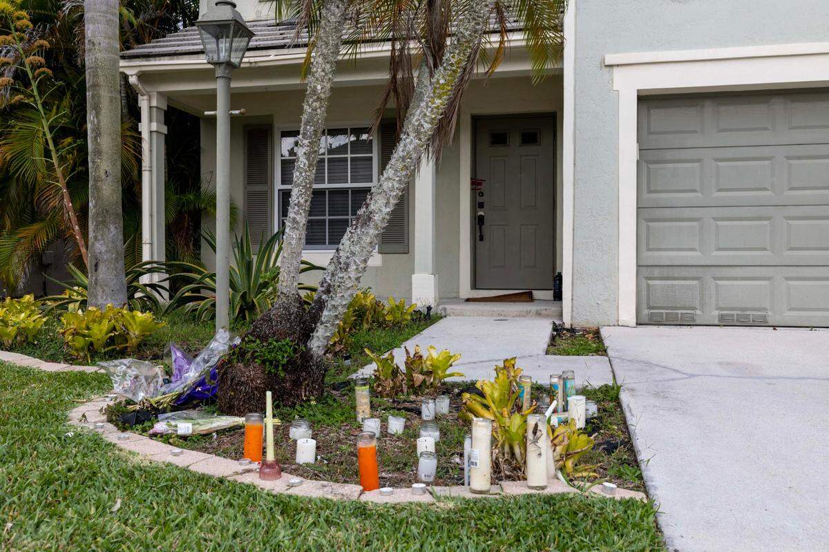 A memorial stands in front of the Tamarac, Florida, home of Mary Catherine Gingles, who was killed in a shooting rampage in the early morning of Feb. 16, 2025. Her estranged husband, Nathan Gingles, has been charged with the murder of her, her father and her neighbor.