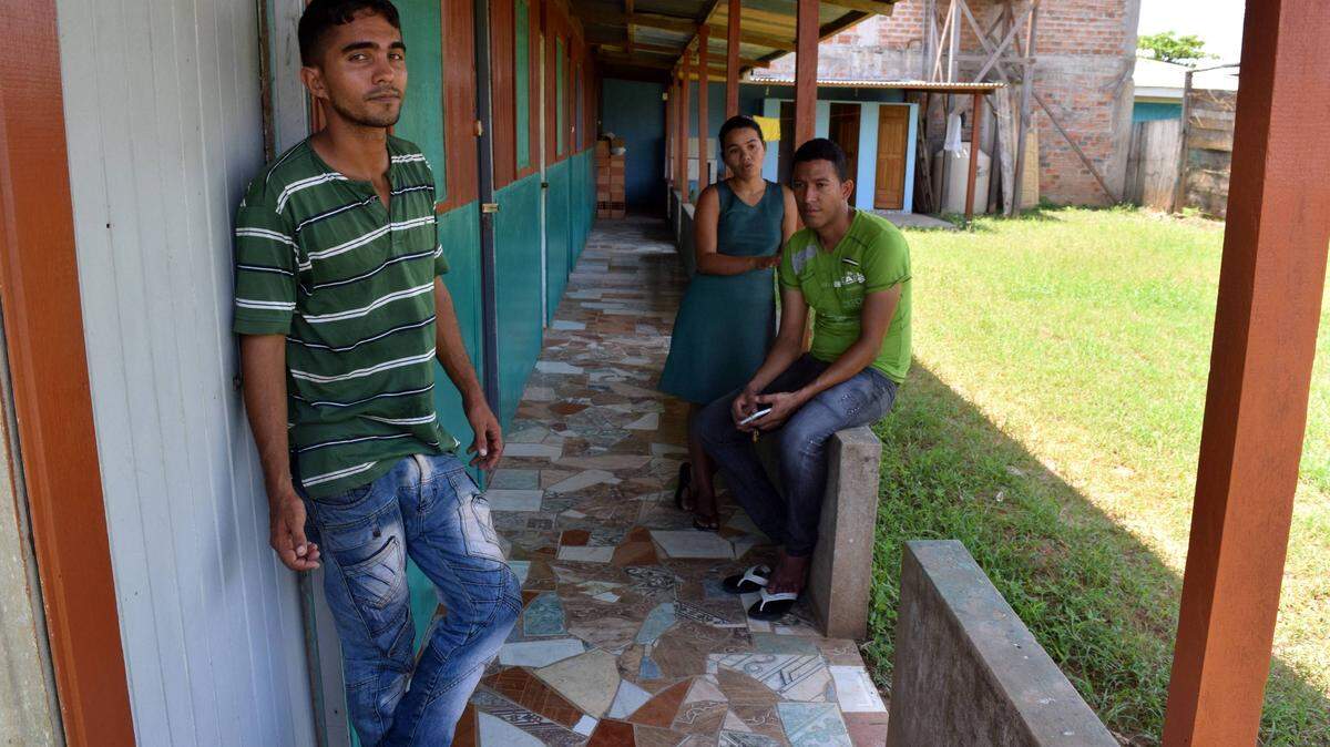 Leonardo León, left, Carolina Alvarez and Adner Guerra are Venezuelans who have settled in Iñapari, a small town in southeastern Peru. More than 2.3 million Venezuelans have fled their country in recent years, and while most of them have ended up in large cities, even small towns like Iñapari are starting to receive migrants.