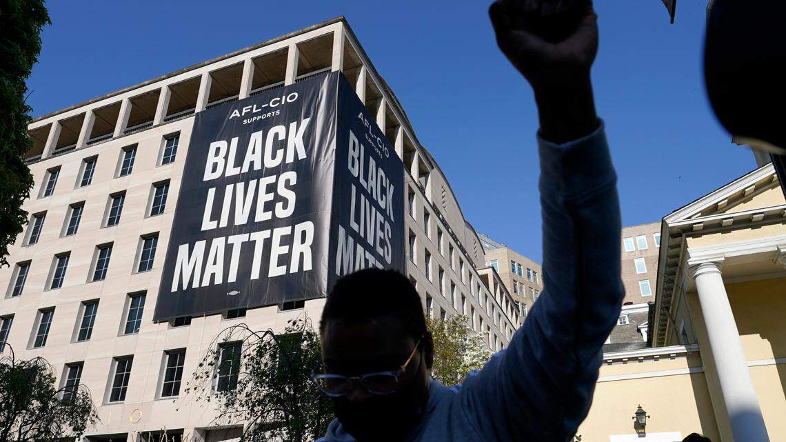 A person reacts on Tuesday, April 20, 2021, in Washington, at Black Lives Matter Plaza near the White House after the verdict in Minneapolis, in the murder trial against former Minneapolis police officer Derek Chauvin was announced.