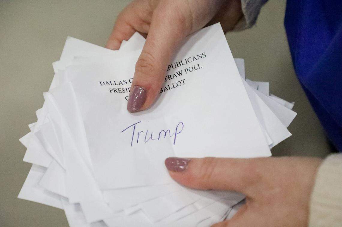 Neutral caucus observer Liliana Norkaitis, 19, of Fallston, MD, holds a stack of Trump ballots from caucus-goers at South Middle School in Waukee, IA, which hosted precincts #5 and #6 during Caucus Night on Monday, Jan 15, 2024.