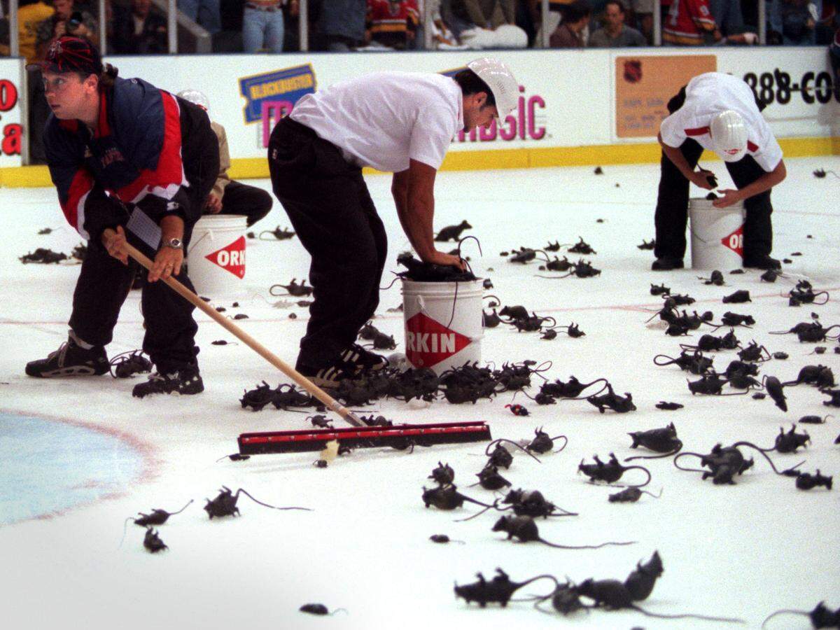 Rat cleanup on the ice after the Panthers scored their first goal during game three of the Stanley Cup Finals at the Miami Arena on June 8, 1996.