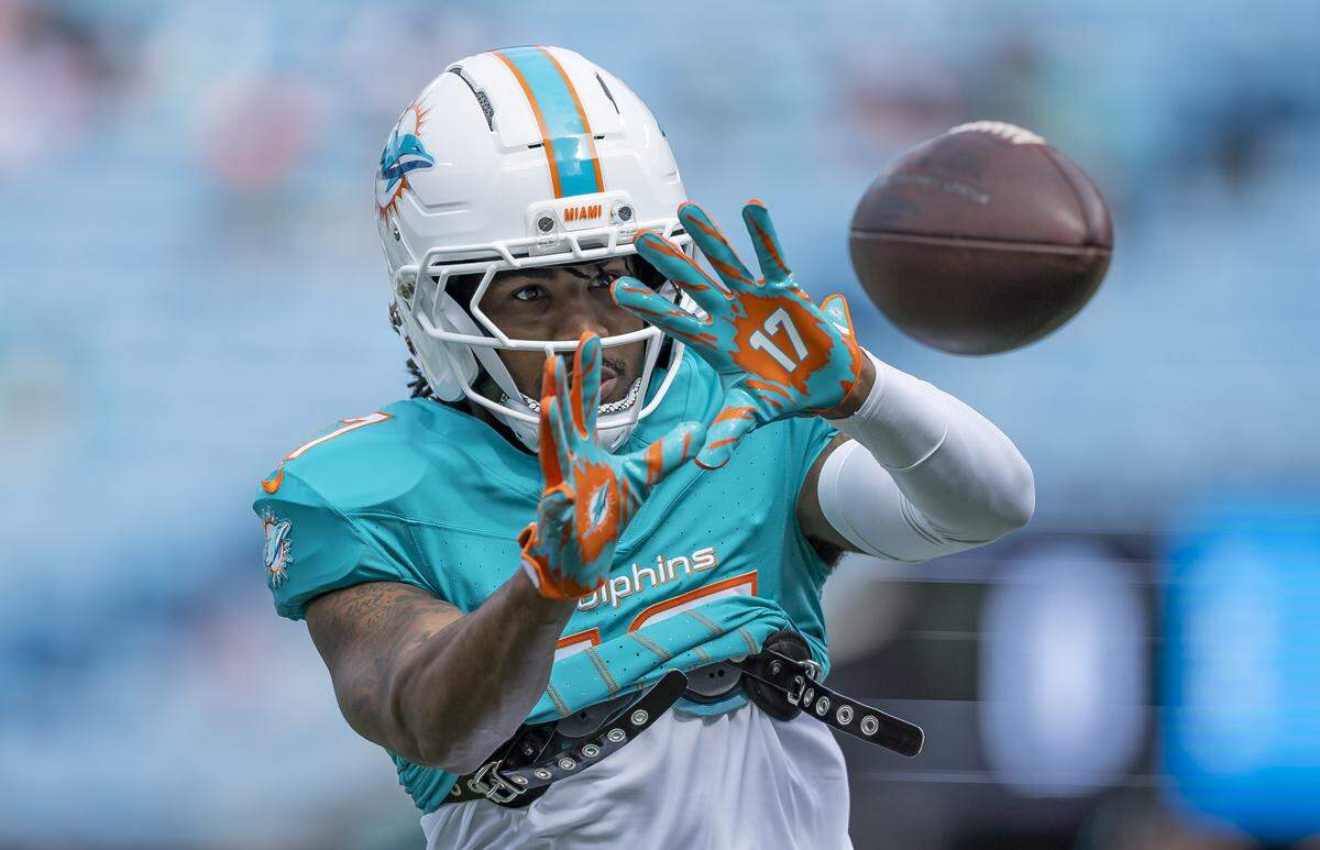 Miami Dolphins wide receiver Jaylen Waddle (17) catches the ball as he prepares to play against the Carolina Panthers in their NFL game at the Bank of America Stadium on Sunday, Oct. 5, 2025, in Charlotte, N.C.