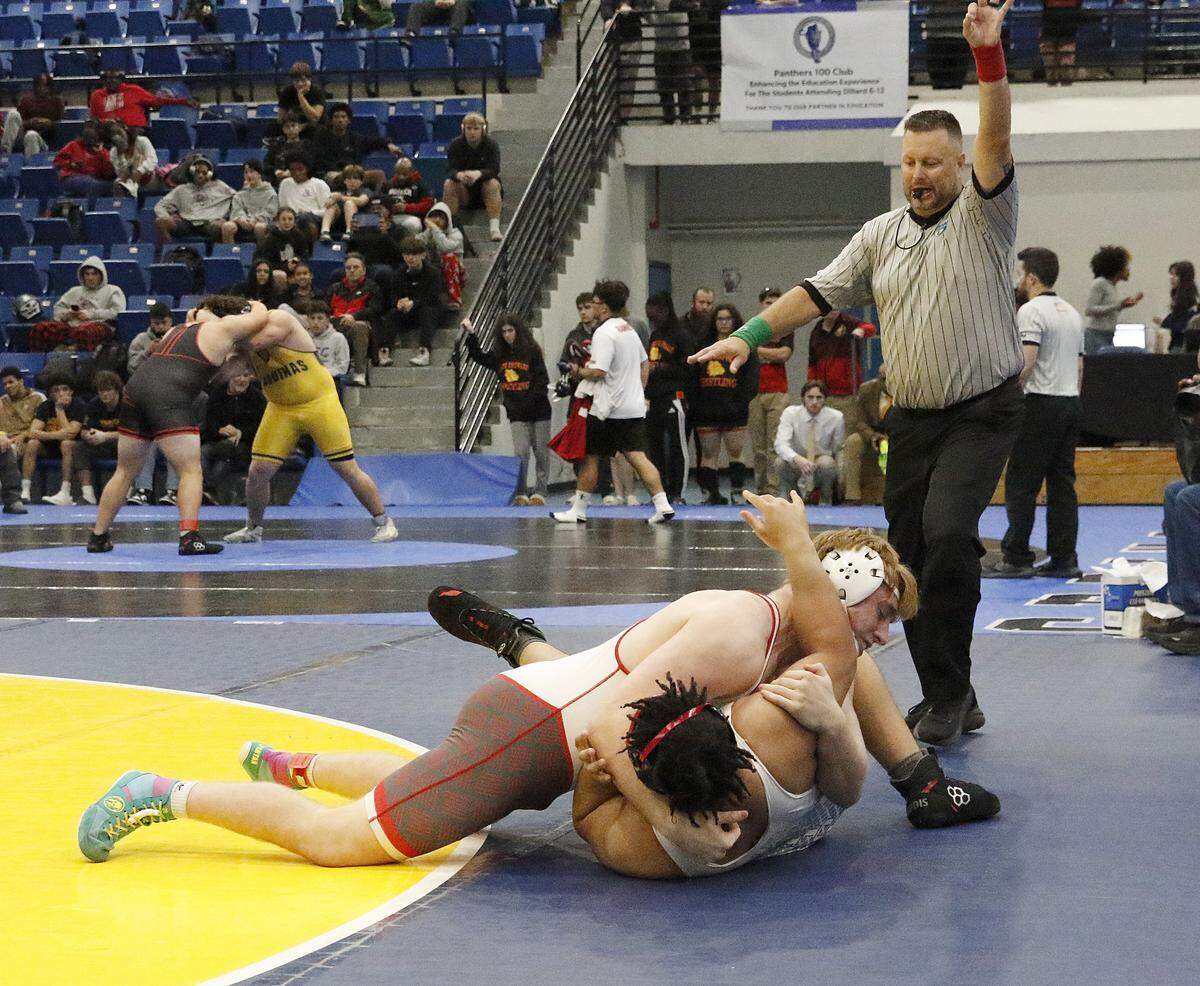 Michael Mocco of Cardinal Gibbons HS (top) wrestlers Lamon Witherspoon of Miramar HS in the 285-pound championship match at the BCAA Wrestling Championships on Saturday, February 7, 2026 at Dillard HS in Fort Lauderdale. P. Mocco won the match. Andrew Uloza / for Miami Herald