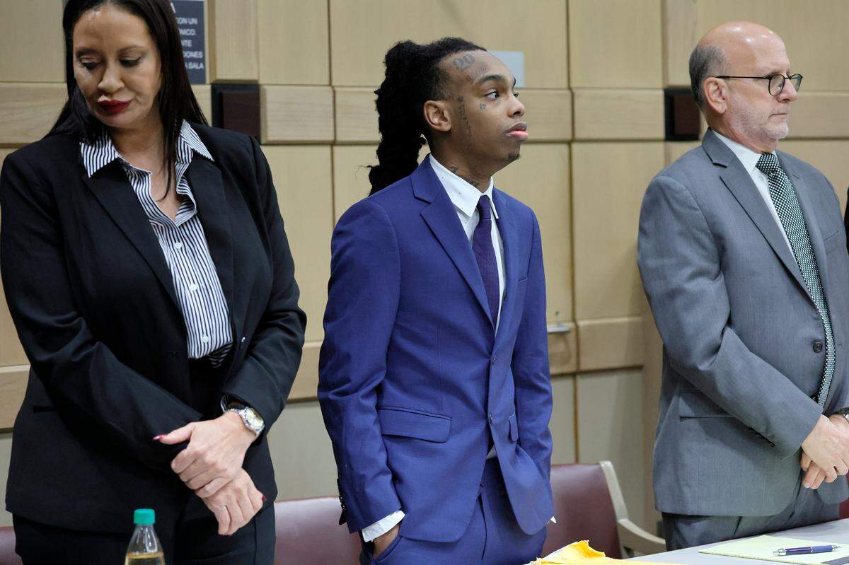 Jamell Demons, better known as rapper YNW Melly, stands with his attorneys,Raven Ramona Liberty, left, and Stuart Adelstein, as jurors enter the courtroom for closing arguments in his trial at the Broward County Courthouse in Fort Lauderdale on Thursday, July 20, 2023. Demons, 22, is accused of killing two fellow rappers and conspiring to make it look like a drive-by shooting in October 2018. (Amy Beth Bennett / South Florida Sun Sentinel)
