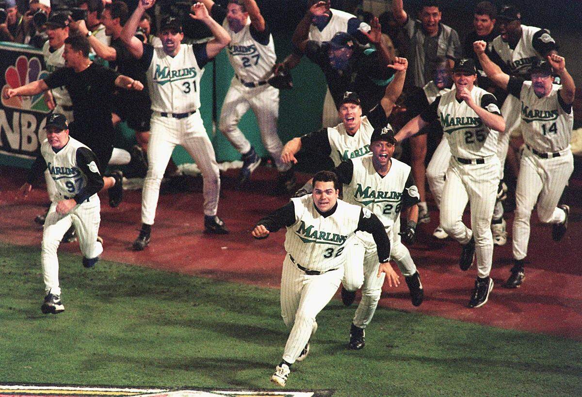 The champion Florida Marlins react to the game winning hit in Game 7 of the 1997 World Series.