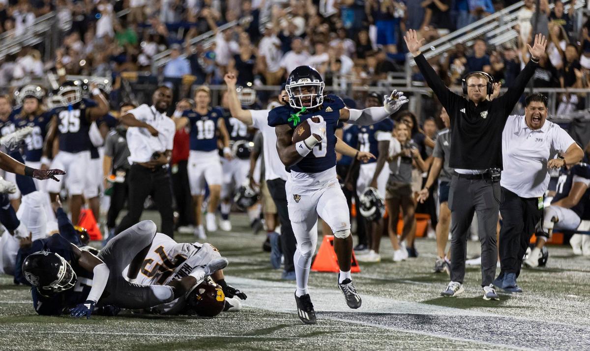 FIU Panthers defensive back Antonio Patterson (9) runs toward the end zone after catching an interception against the Central Michigan Chippewas in the fourth quarter of their NCAA DI football game at Pitbull Stadium on Saturday, Sept. 7, 2024, in Miami, Fla.