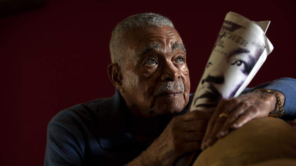 Garth Reeves, the retired publisher of The Miami Times newspaper, holds an MLK special edition published by The Miami Times. He was 92 at the time. Reeves has died at 100.