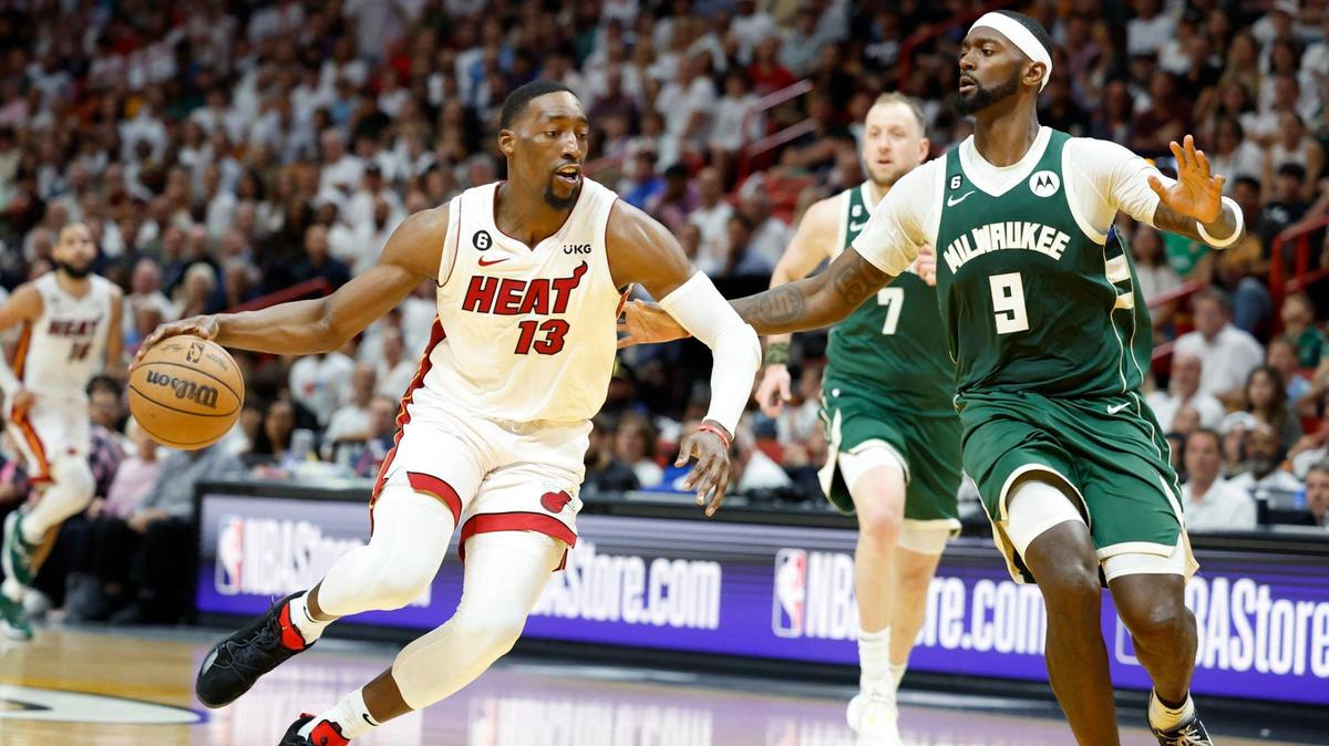 Miami Heat center Bam Adebayo (13) drives the ball as Milwaukee Bucks forward Bobby Portis (9) defends in the fourth quarter during game 3 of the first-round playoff series at the Kaseya Center in Miami on Saturday, April 22, 2023.