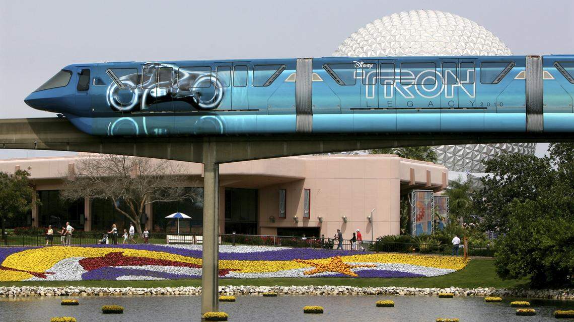 The iconic Walt Disney World monorail --recently-branded with a Tron theme-- passes through Future World at Epcot, Thursday , March 25, 2010. It is the first time a monorail hs been used in a movie marketing campaign; Tron: Legacy is a sequel planned for a Christmas 2010 release. (Joe Burbank/Orlando Sentinel) Newsgate #B58354389Z.1 to go with jason garcia story ORG XMIT: ORL1003251630473698